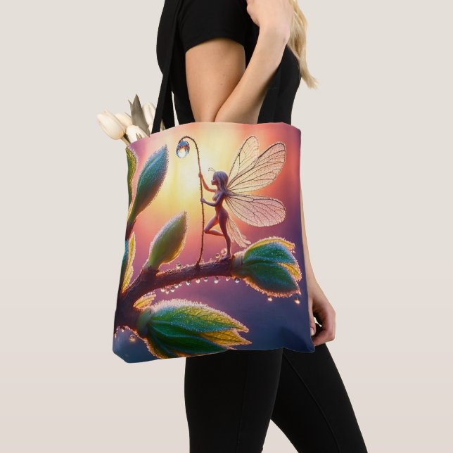 Magical fairy with dewdrop lantern on the branch tote bag (Close Up)