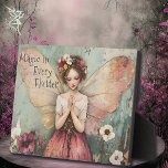 Magical Whimsical Fairy & Flower Garden with Quote Plaque<br><div class="desc">Add a touch of enchantment to your home with this **Whimsical Fairy & Flower Garden Tabletop Plaque with Easel**. Featuring a delicate pastel-coloured fairy surrounded by a beautiful garden, this plaque is adorned with the uplifting quote, "Magic in Every Flutter." The intricate, whimsical art and soft, dreamy colours create a...</div>