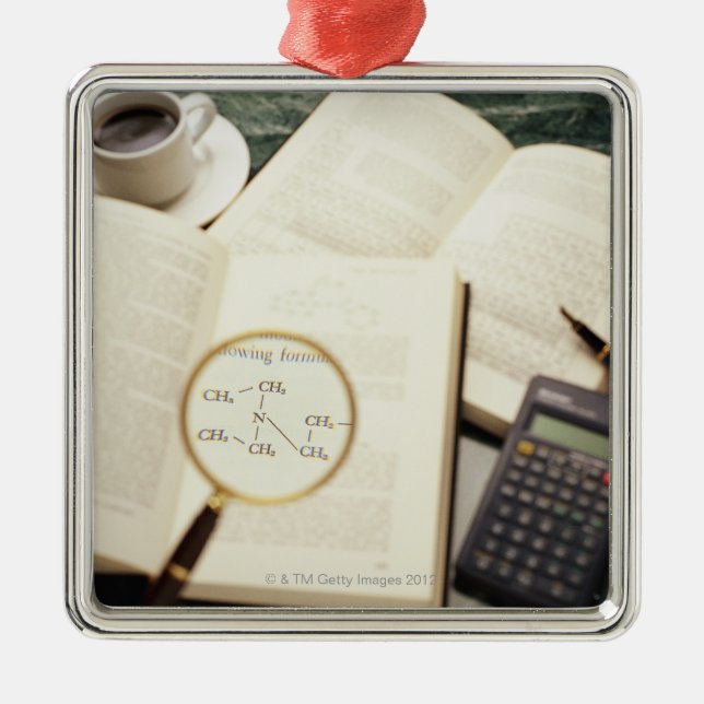 Magnifying glass enlarging molecular diagram metal tree decoration (Front)