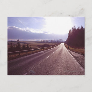 Main road with low winter sun. postcard