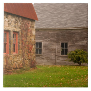 Maine, Old stone building and wooden barn in Tile