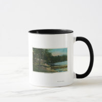 MaineView of a Woman on a Canoe by the Shore