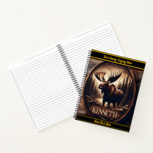 Majestic moose carved against a forest backdrop notebook
