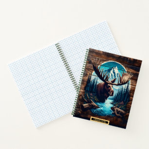 Majestic moose in serene wilderness by a river notebook