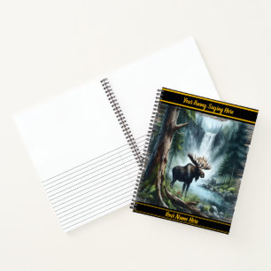 Majestic moose standing near a tranquil waterfall notebook