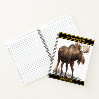 Majestic moose wandering through a snowy landscape notebook