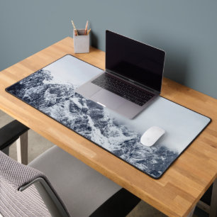 Majestic mountains below clouds desk mat
