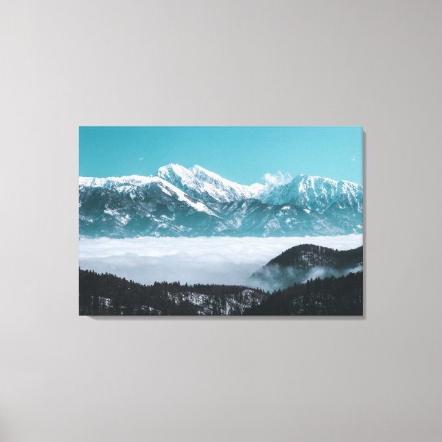 Majestic mountains rising over foggy valley canvas print (Front)