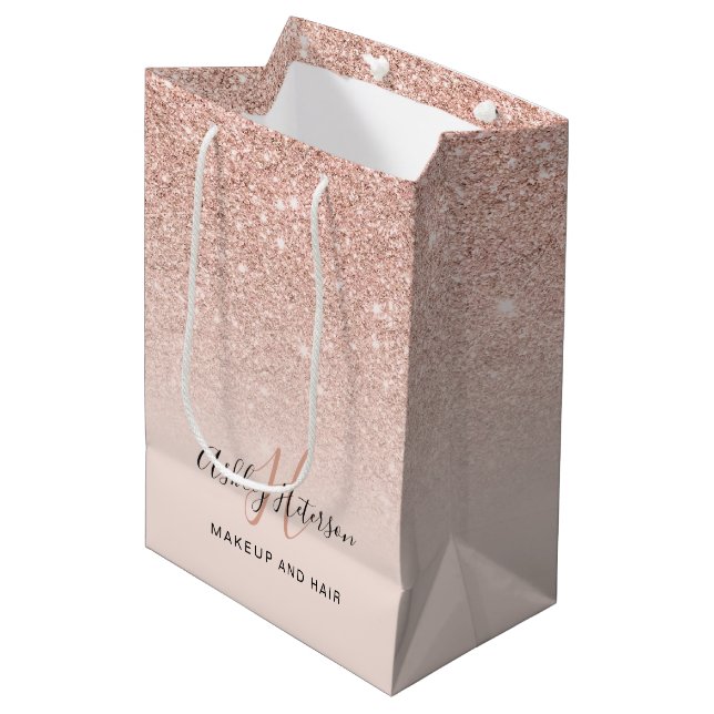 Makeup monogram blush rose gold glitter script medium gift bag (Front Angled)