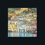Malcesine on Lake Garda By Gustav Klimt Canvas Print<br><div class="desc">Malcesine on Lake Garda (1913) by Gustav Klimt is a vintage Victorian Era Art Nouveau fine art symbolism painting. A beautiful view of the Italian city of Malcesine with buildings and houses on the edge of the harbour. The homes and boats cast a reflection in the calm water. You can...</div>