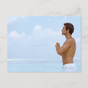 Maldives, Smart young guy practicing yoga at Postcard