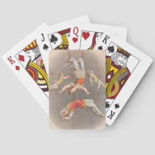 Male And Female Trapeze Performers Playing Cards
