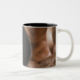 Male body builder flexing lifting weight Two-Tone coffee mug
