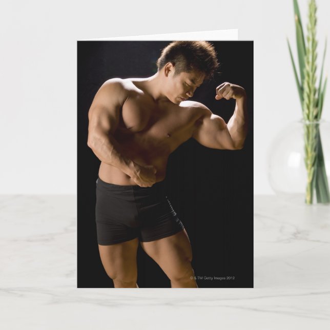 Male bodybuilder flexing muscles, front view, card (Front)