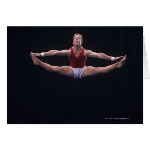 Male gymnast performing on the floor exercise