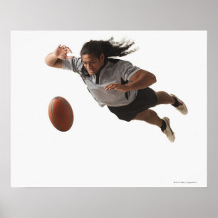 Male rugby player diving for ball poster