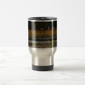 Mallards rising from water travel mug
