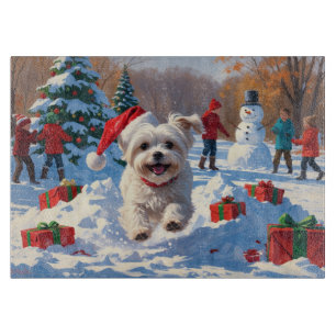 Maltese Dog Running in Snow with Christmas Hat Cutting Board