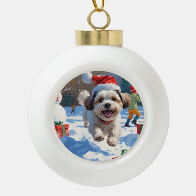 Malti Tzu Running in Snow with Christmas Hat Ceramic Ball Christmas Ornament (Front)