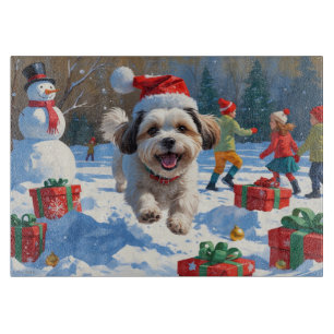 Malti Tzu Running in Snow with Christmas Hat Cutting Board