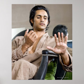 Man admiring his manicure poster
