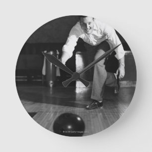 Man Bowling Round Clock