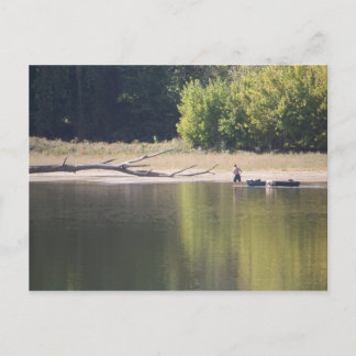 Man, Canoe, Dog, and Driftwood Postcard