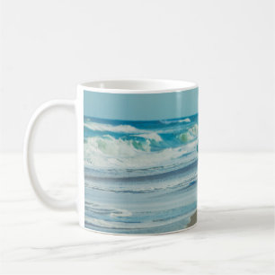 Man carrying surfboard at beach coffee mug