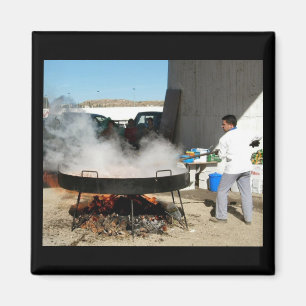 Man cooking a giant Spanish paella - magnet