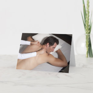 Man having a back massage from woman card