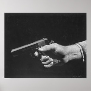 Man Holding Gun Poster