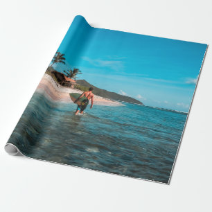 Man holding surf board in body of water wrapping paper