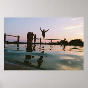 Man jump in mid air on body of water poster