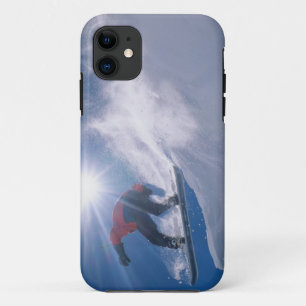 Man jumping off a large cornince on a snowboard iPhone 11 case