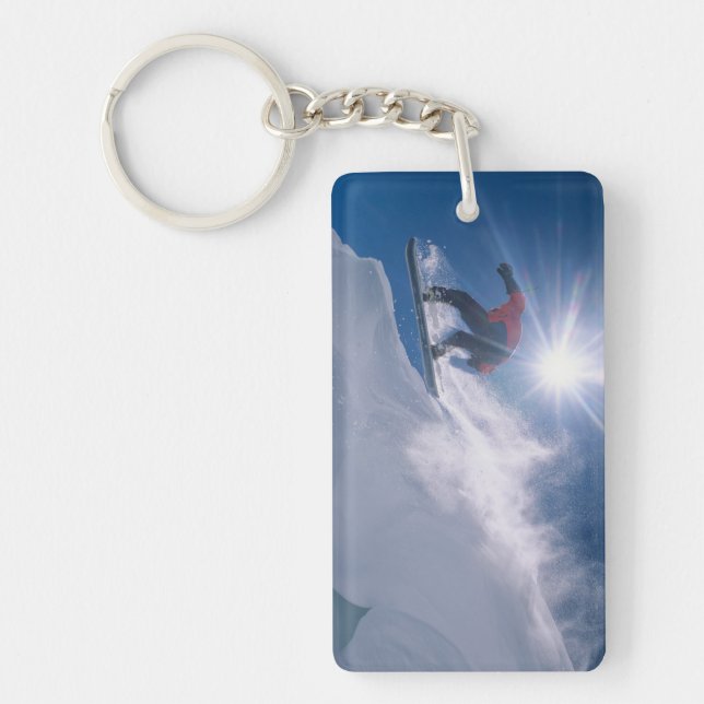 Man jumping off a large cornince on a snowboard key ring (Front)