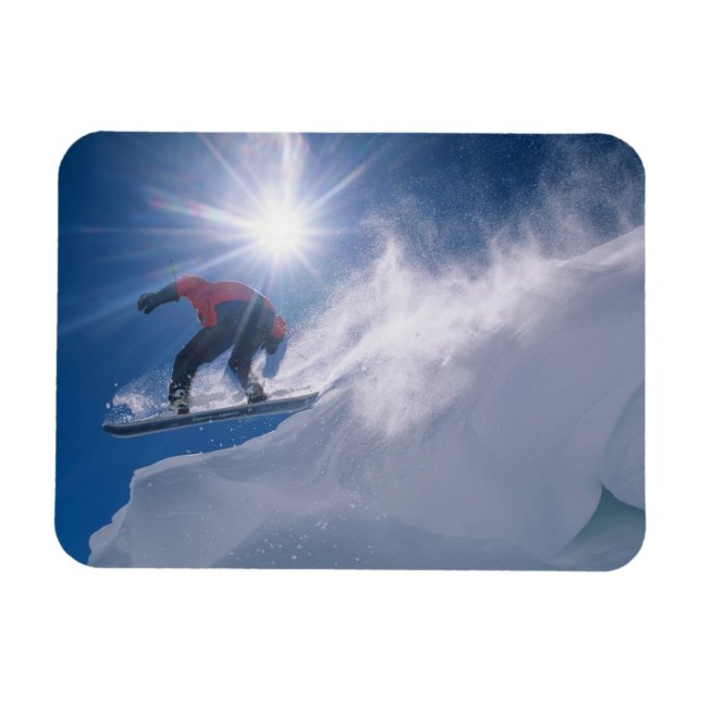 Man jumping off a large cornince on a snowboard magnet (Horizontal)