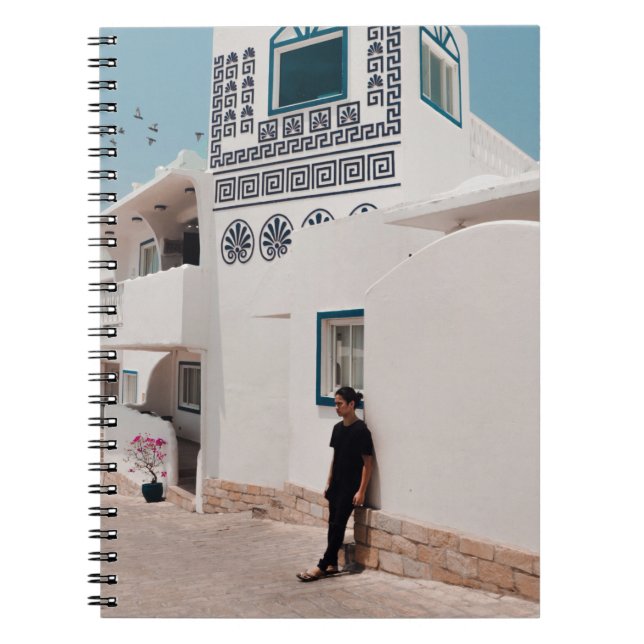Man lean on concrete house notebook (Front)