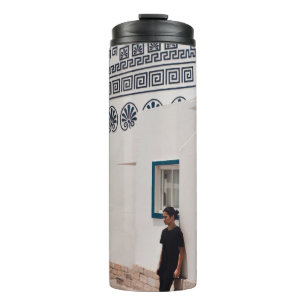 Man lean on concrete house thermal tumbler