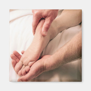 Man Massaging Male Foot Magnet