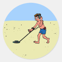 Man Metal Detecting On Beach