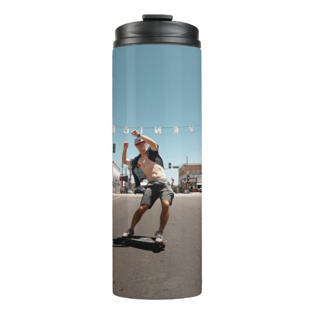 Man playing skateboard thermal tumbler (Front)