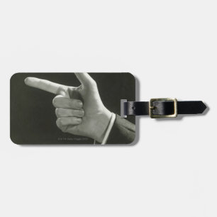 Man Pointing Luggage Tag