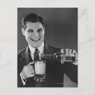 Man pouring beer from bottle to pitcher (B&W), Postcard