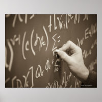 Man printing math equations on a chalkboard