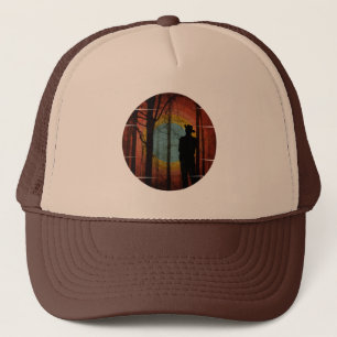 MAN STANDING IN THE WOODS FOREST TRUCKER HAT