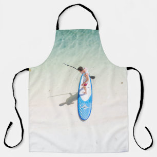 Man surfing on beach apron