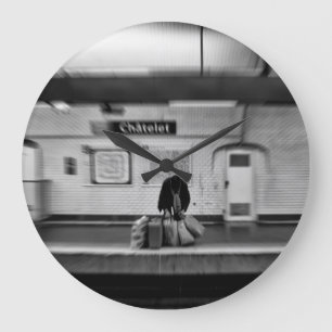 Man with shopping bags in subway (Chatelet) Large Clock