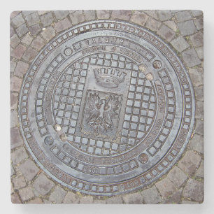 Manhole cover and cobblestone road stone coaster