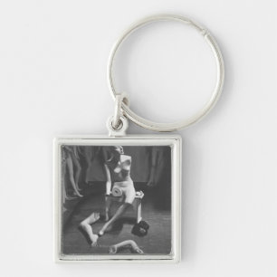 Mannequin with leg and arm removed key ring