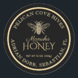 Manuka Honey Black Dark Gold Vintage Bee  Classic Round Sticker<br><div class="desc">Personalise this honey label with your apiary name,  owner name,  net weight and address. Elegant gold script font in the centre spells out "Manuka Honey." Vintage Bee illustration on a black background. Common honey net weight conversions: 8oz (227g),  12oz (340g),  16oz (454g),  32oz (907g),  5lb (2.27kg).</div>